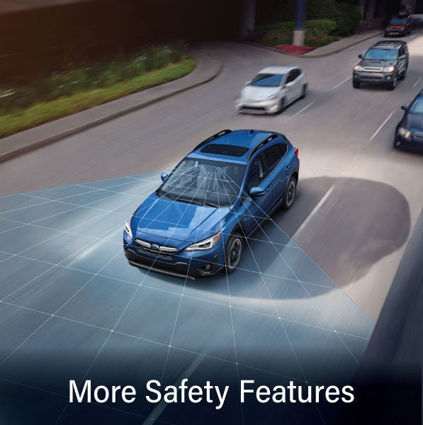 A Subaru Crosstrek in blue with the words &ldquo;More Safety Features&ldquo;. | Dellenbach Subaru in Fort Collins CO
