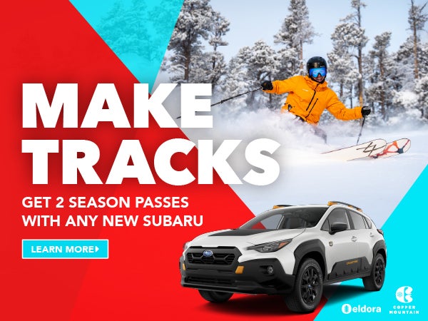 2026 Crosstrek Wilderness parked in front of a person skiing